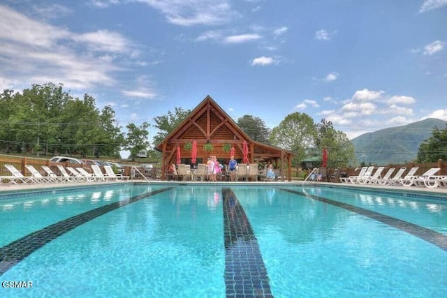 view of pool featuring a gazebo and a mountain view