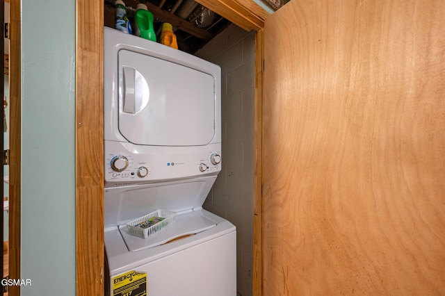 laundry area with stacked washer / drying machine