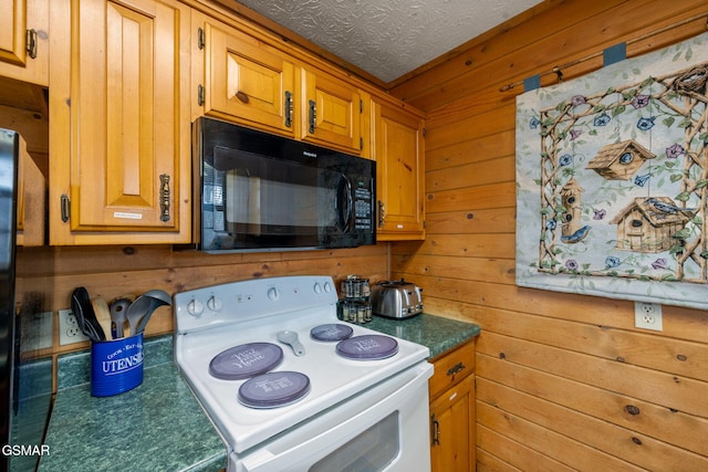 kitchen featuring white electric range, wooden walls, and a textured ceiling