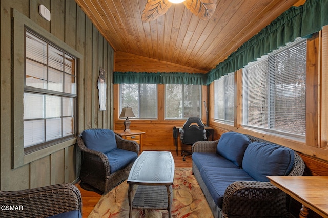 sunroom with vaulted ceiling, ceiling fan, and wood ceiling