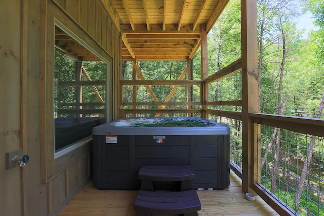 unfurnished sunroom with wood ceiling