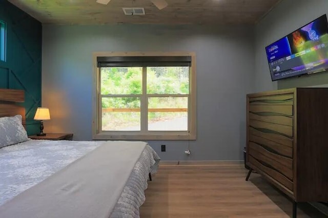 bedroom featuring hardwood / wood-style flooring and ceiling fan