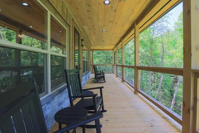 sunroom featuring wood ceiling