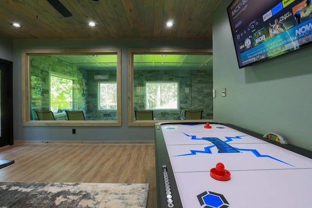 recreation room featuring hardwood / wood-style floors and wood ceiling