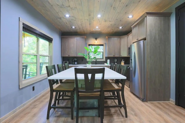 kitchen with backsplash, light hardwood / wood-style flooring, wooden ceiling, and stainless steel refrigerator with ice dispenser