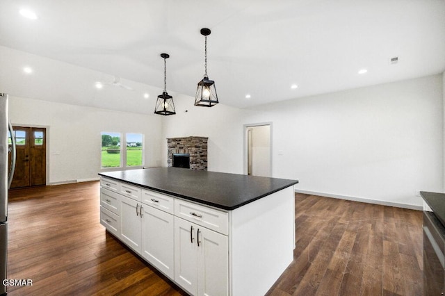 1902 Kaylee Dr, Jefferson City, TN 37760 - kitchen with dark countertops, a stone fireplace, dark wood-type flooring, white cabinets, and recessed lighting