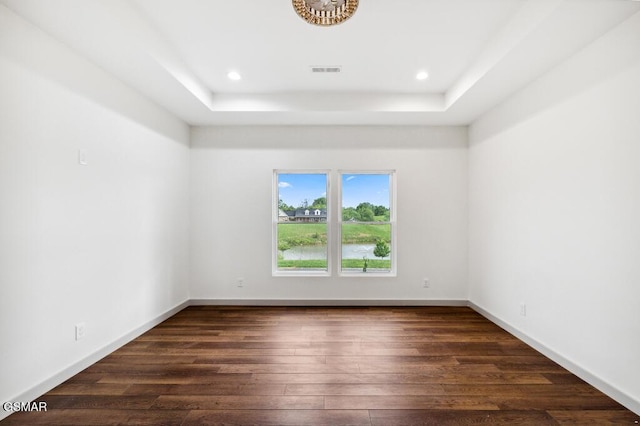 1902 Kaylee Dr, Jefferson City, TN 37760 - unfurnished room with dark wood-type flooring, a tray ceiling, recessed lighting, and baseboards