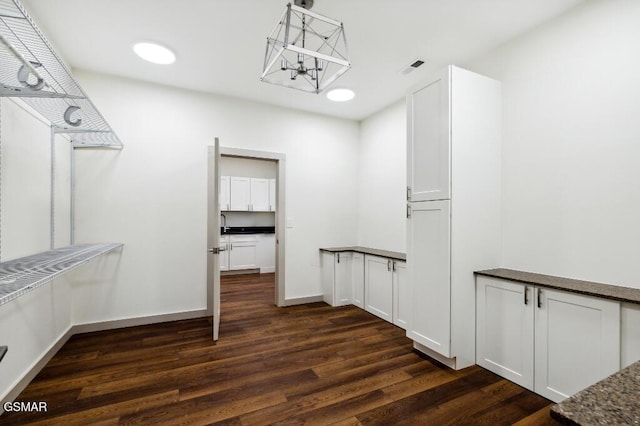 1902 Kaylee Dr, Jefferson City, TN 37760 - walk in closet with a chandelier and dark wood-style floors