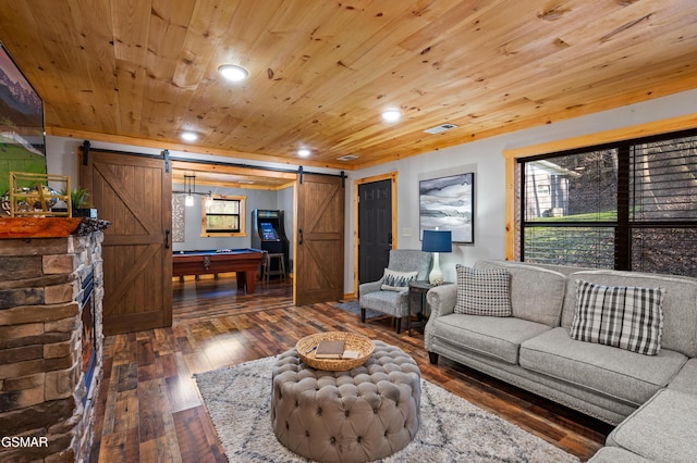 519 Mcmahan Rd, Pigeon Forge, TN 37863 - living room with a barn door, hardwood / wood-style floors, plenty of natural light, and wooden ceiling
