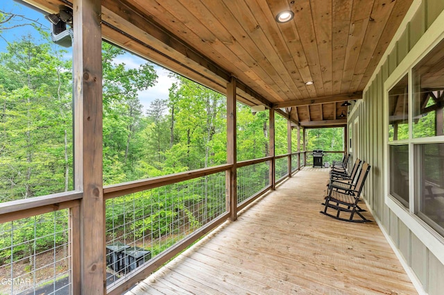 deck featuring a wooded view