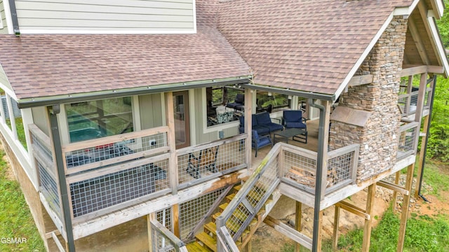view of property exterior featuring a shingled roof, outdoor lounge area, and stone siding