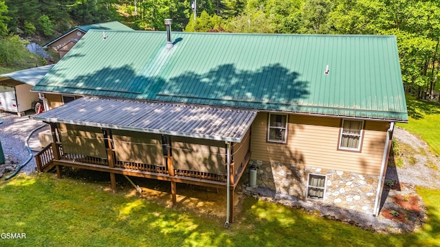 1878 Omaha Rd, Del Rio, TN 37727 - rear view of house featuring metal roof, stone siding, a yard, and a deck