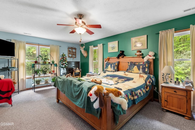 1878 Omaha Rd, Del Rio, TN 37727 - bedroom with carpet flooring, a ceiling fan, and a textured ceiling