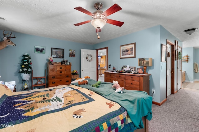 1878 Omaha Rd, Del Rio, TN 37727 - bedroom with light carpet, baseboards, a textured ceiling, ceiling fan, and ensuite bathroom