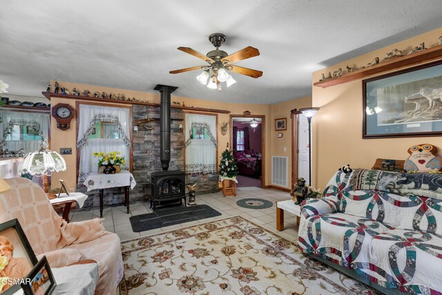 1878 Omaha Rd, Del Rio, TN 37727 - tiled living room with a wood stove and a ceiling fan