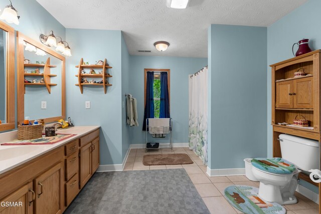 1878 Omaha Rd, Del Rio, TN 37727 - bathroom featuring toilet, tile patterned floors, double vanity, curtained shower, and baseboards