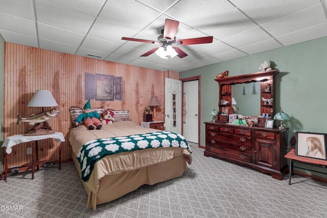 1878 Omaha Rd, Del Rio, TN 37727 - bedroom featuring a paneled ceiling, wooden walls, carpet floors, and a ceiling fan