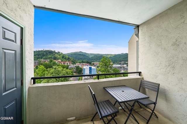 balcony featuring a mountain view