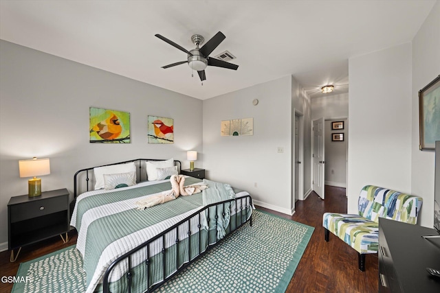 bedroom featuring ceiling fan and dark hardwood / wood-style flooring