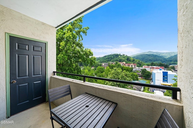 balcony featuring a mountain view