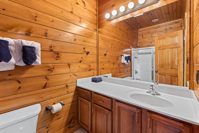 bathroom with toilet, a washtub, an enclosed shower, wooden walls, and vanity