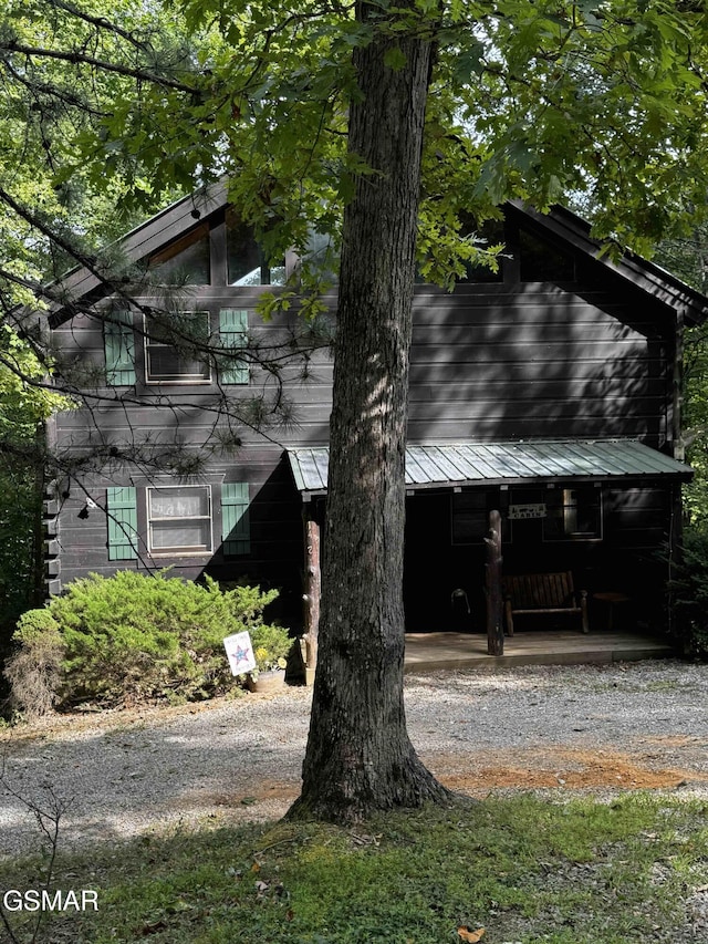 view of side of home featuring a porch