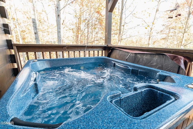 deck featuring sink and a hot tub