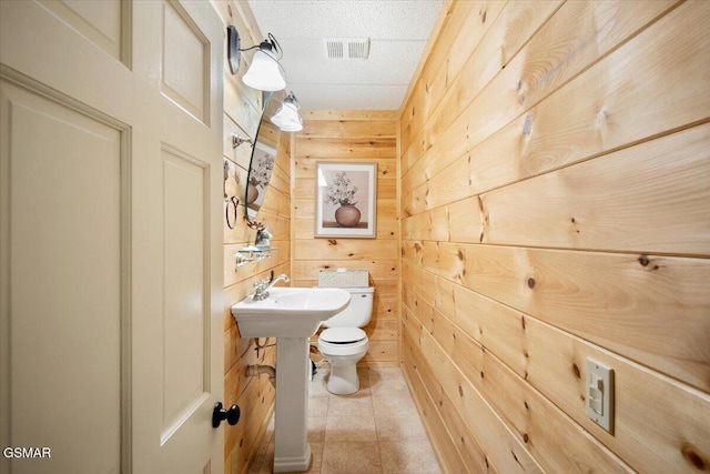 4164 Lumber Jack Way, Sevierville, TN 37876 - bathroom featuring wood walls and toilet