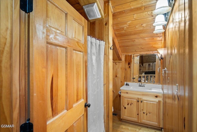 4164 Lumber Jack Way, Sevierville, TN 37876 - bathroom with vaulted ceiling, vanity, wooden ceiling, wooden walls, and wood finished floors