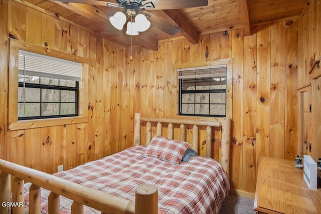 4164 Lumber Jack Way, Sevierville, TN 37876 - bedroom featuring wooden ceiling with exposed beams, wooden walls, and carpet floors