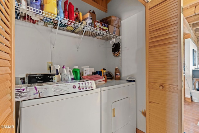 clothes washing area featuring laundry area and separate washer and dryer