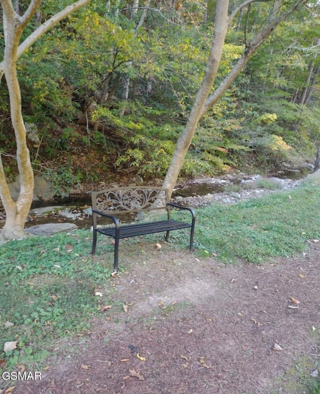 view of property's community with a forest view