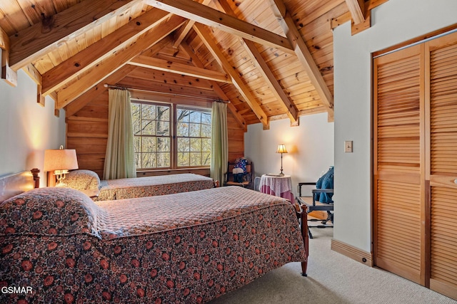 bedroom featuring carpet floors, wooden ceiling, and lofted ceiling with beams