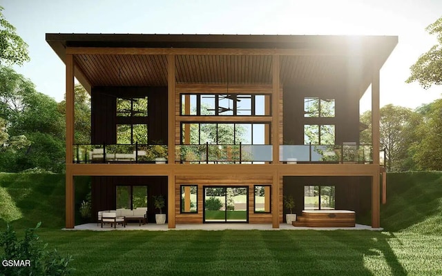 back of property featuring a yard, a patio, a balcony, and outdoor lounge area