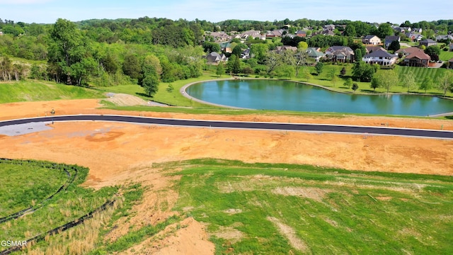 surrounding community with a water view and a residential view