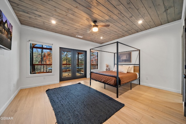 bedroom with ceiling fan, light hardwood / wood-style flooring, wooden ceiling, and french doors