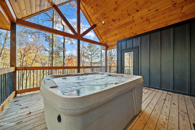 deck featuring a hot tub