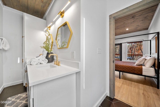 bathroom featuring sink, wooden ceiling, and tile patterned flooring