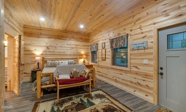 bedroom with wood walls, wood-type flooring, and wooden ceiling