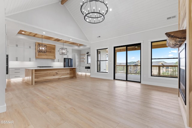 206 Eagle View Dr, Dandridge, TN 37725 - unfurnished living room with a chandelier, light wood finished floors, a wooden ceiling with exposed beams, high vaulted ceiling, and recessed lighting