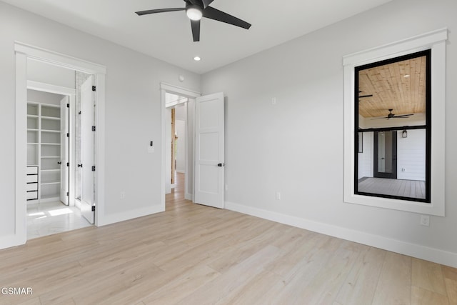 206 Eagle View Dr, Dandridge, TN 37725 - unfurnished bedroom with light wood-type flooring, recessed lighting, a walk in closet, and a ceiling fan