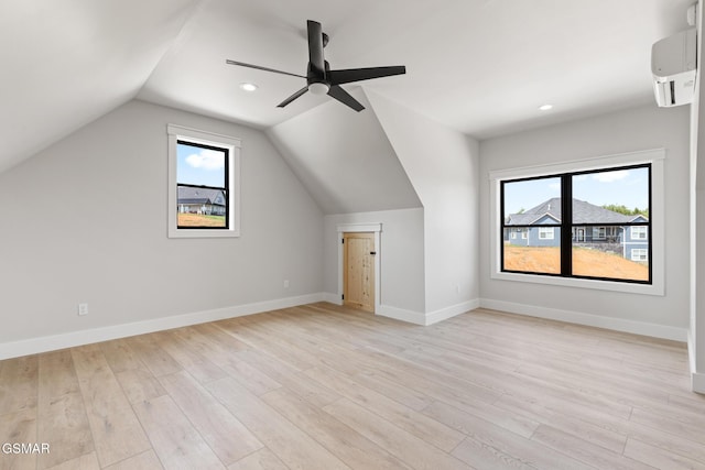 206 Eagle View Dr, Dandridge, TN 37725 - additional living space with an AC wall unit, light wood-style floors, a ceiling fan, lofted ceiling, and recessed lighting