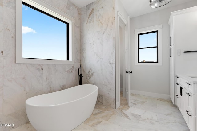 206 Eagle View Dr, Dandridge, TN 37725 - full bathroom featuring a freestanding bath, vanity, and marble tiled flooring