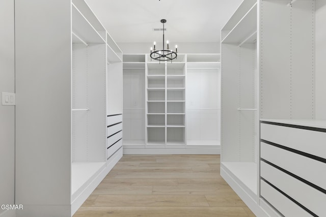 206 Eagle View Dr, Dandridge, TN 37725 - walk in closet with light wood-style floors and a chandelier