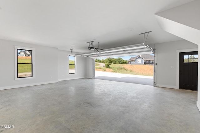206 Eagle View Dr, Dandridge, TN 37725 - garage with baseboards and a garage door opener