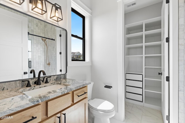 206 Eagle View Dr, Dandridge, TN 37725 - bathroom featuring marble finish flooring, vanity, a walk in closet, and a shower with shower door