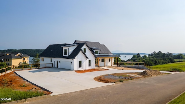 206 Eagle View Dr, Dandridge, TN 37725 - modern farmhouse style home featuring board and batten siding, driveway, and an attached garage