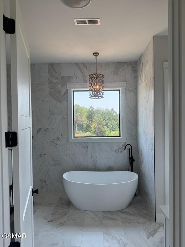 206 Eagle View Dr, Dandridge, TN 37725 - full bathroom with a freestanding bath, marble finish floors, and a chandelier