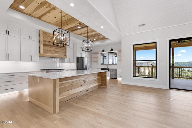 206 Eagle View Dr, Dandridge, TN 37725 - kitchen with stainless steel appliances, wooden ceiling, a chandelier, custom exhaust hood, and a spacious island