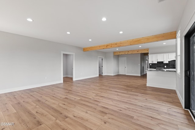 206 Eagle View Dr, Dandridge, TN 37725 - unfurnished living room with recessed lighting, light wood-style flooring, and beamed ceiling